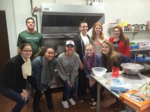 Contributed photo: Students from a Christology class taught by Mary Hembrow-Snyder, Ph.D., took part in a Service Learning project at the end of October. The class served dinners to between 25 to 30 residents at the Emergency Shelter and the Lodge on Sass.